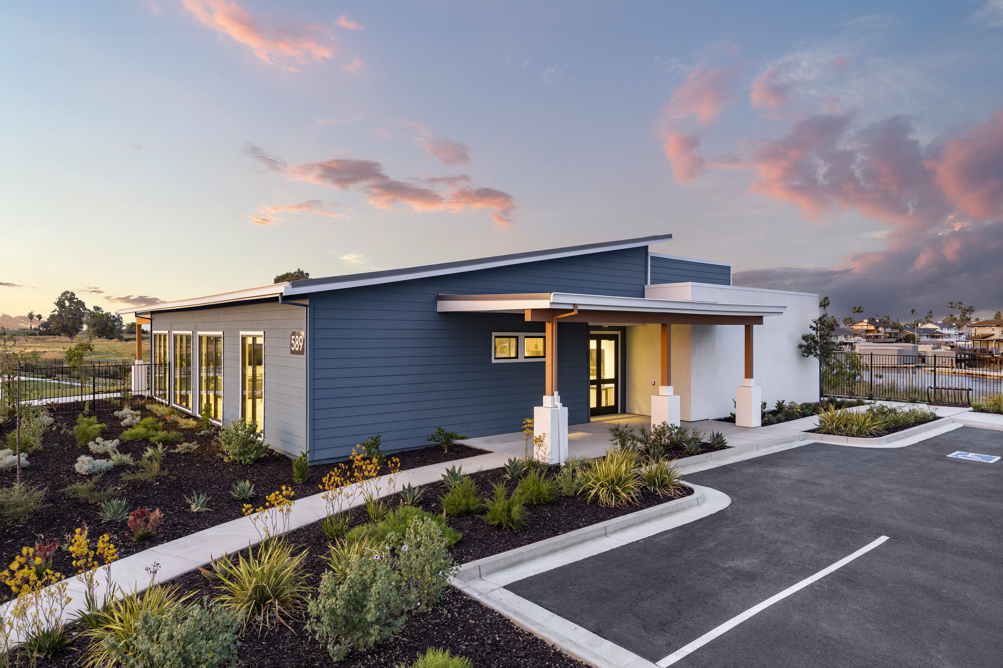 Seagrass clubhouse front exterior at twilight